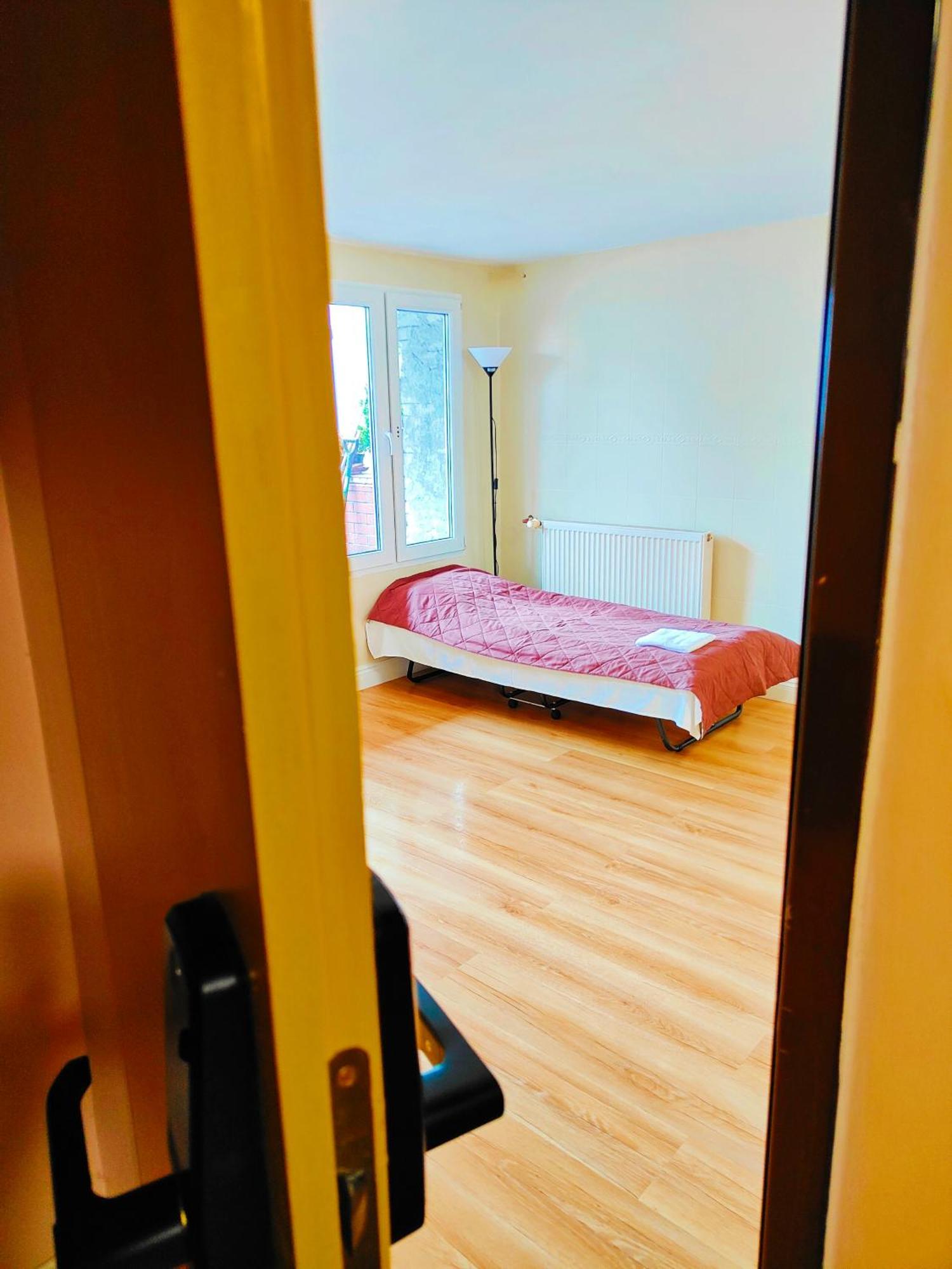Bed in 4-Bed Dormitory Room with Shared Bathroom